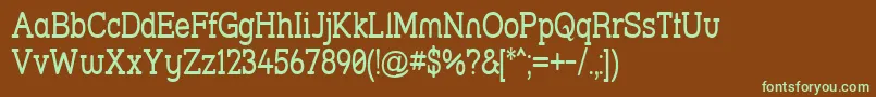 フォントStrslna – 緑色の文字が茶色の背景にあります。