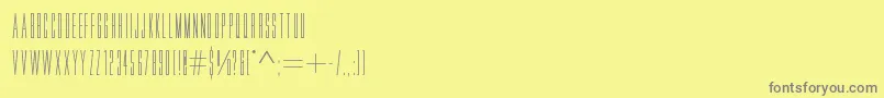 Movlette-fontti – harmaat kirjasimet keltaisella taustalla