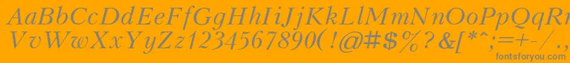 KudrashovcItalic-Schriftart – Graue Schriften auf orangefarbenem Hintergrund