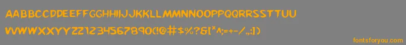 フォントKreeture – オレンジの文字は灰色の背景にあります。