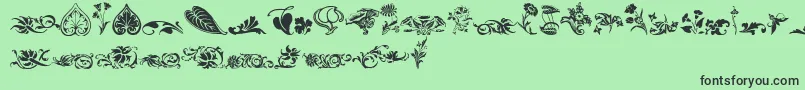 Шрифт Wwfloralcorner – чёрные шрифты на зелёном фоне