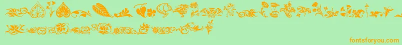 Wwfloralcorner-fontti – oranssit fontit vihreällä taustalla