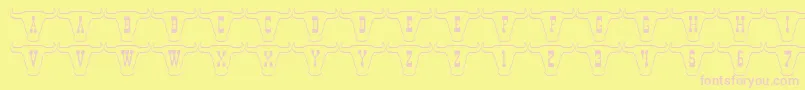 フォント101TexanStyle – ピンクのフォント、黄色の背景