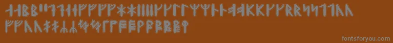 フォントYggdrasilrunic – 茶色の背景に灰色の文字