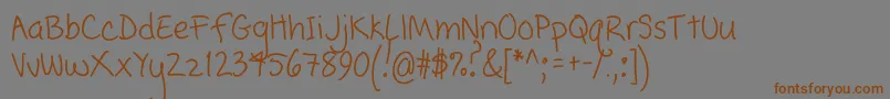 PopcornMountainCondensed-Schriftart – Braune Schriften auf grauem Hintergrund