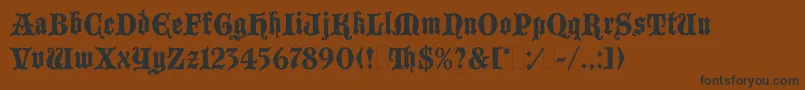 BlackmoorLetPlain.1.0 Font – Black Fonts on Brown Background