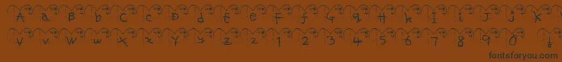 Ha ffy-Schriftart – Schwarze Schriften auf braunem Hintergrund