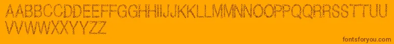 JewelsRegular-Schriftart – Braune Schriften auf orangefarbenem Hintergrund