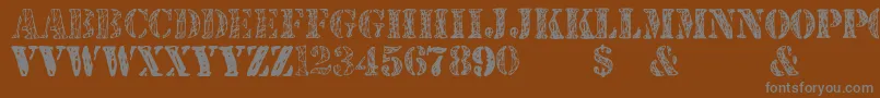 JjstencilTrialVersion-Schriftart – Graue Schriften auf braunem Hintergrund