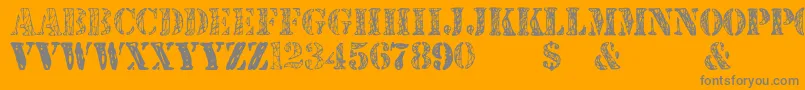 JjstencilTrialVersion-Schriftart – Graue Schriften auf orangefarbenem Hintergrund