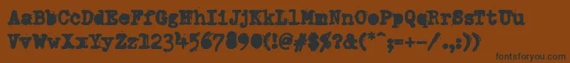 PfdumboldtypetwoAlterheavy Font – Black Fonts on Brown Background