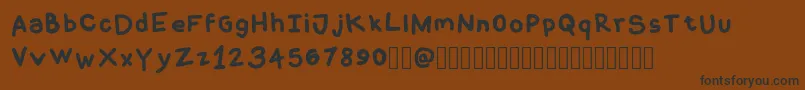 CoquerliRegular Font – Black Fonts on Brown Background