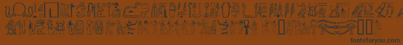 Gwglyptt-Schriftart – Schwarze Schriften auf braunem Hintergrund
