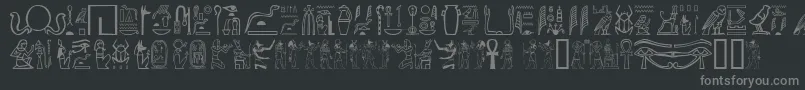 Gwglyptt-Schriftart – Graue Schriften auf schwarzem Hintergrund