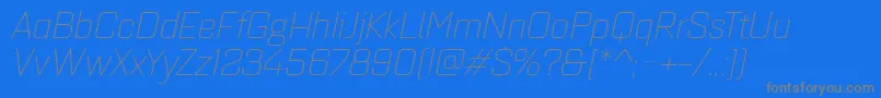 フォントQuarcaextlightitalic – 青い背景に灰色の文字