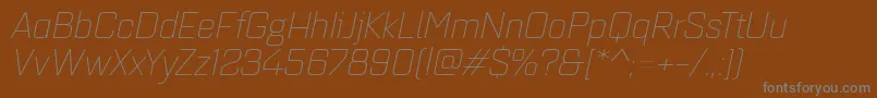 フォントQuarcaextlightitalic – 茶色の背景に灰色の文字