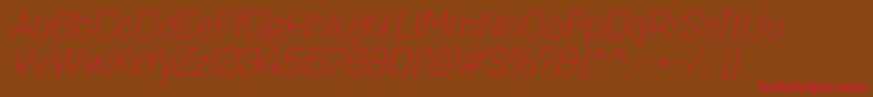 フォントQuarcaextlightitalic – 赤い文字が茶色の背景にあります。