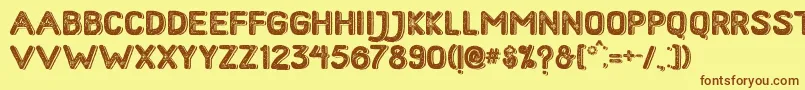 フォントHometownRoughBoldShadow – 茶色の文字が黄色の背景にあります。