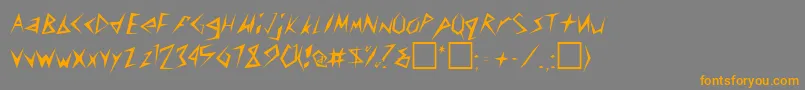 フォントConstantRegular – オレンジの文字は灰色の背景にあります。