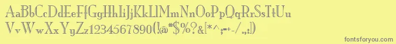 MonarchengravedRegular-fontti – harmaat kirjasimet keltaisella taustalla