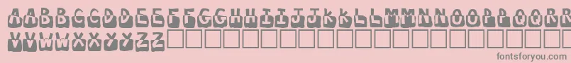 フォントSubmerged – ピンクの背景に灰色の文字