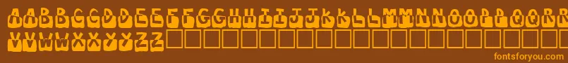 フォントSubmerged – オレンジ色の文字が茶色の背景にあります。