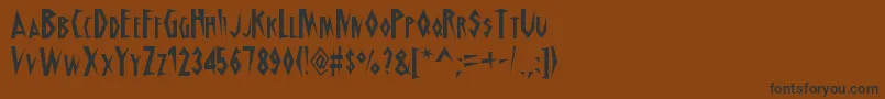 フォントSchrillAoe – 黒い文字が茶色の背景にあります