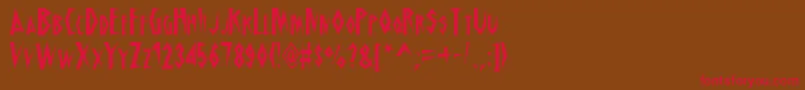 フォントSchrillAoe – 赤い文字が茶色の背景にあります。
