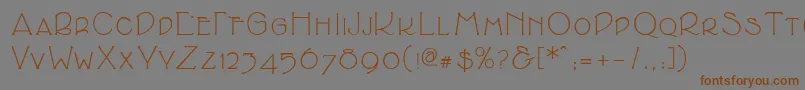 フォントCupolasmallcaps – 茶色の文字が灰色の背景にあります。