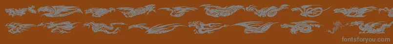 フォントDragonsTfb – 茶色の背景に灰色の文字