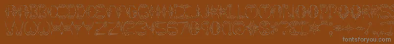 Claw1Brk-fontti – harmaat kirjasimet ruskealla taustalla