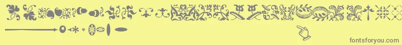 Fonte SabonnextLtOrnaments – fontes cinzas em um fundo amarelo