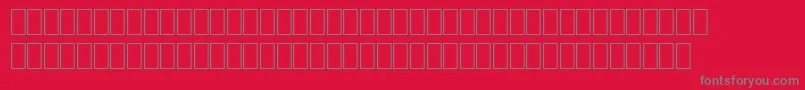 WpMultinationalaHelve-fontti – harmaat kirjasimet punaisella taustalla