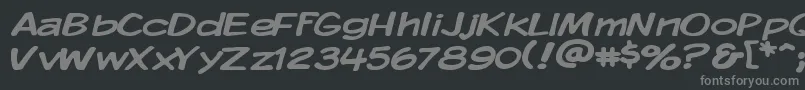 KomikaDisplayWide-fontti – harmaat kirjasimet mustalla taustalla