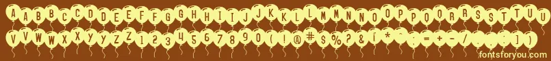 SfBalloons-fontti – keltaiset fontit ruskealla taustalla