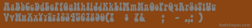 Bellbottom-fontti – harmaat kirjasimet ruskealla taustalla