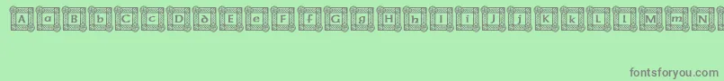 フォントIrishBlessing – 緑の背景に灰色の文字