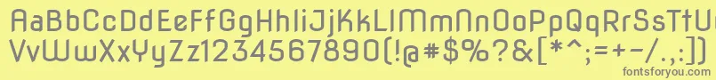 Novaflat-fontti – harmaat kirjasimet keltaisella taustalla