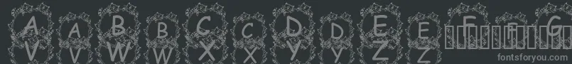 フォントJennaSKitties – 黒い背景に灰色の文字