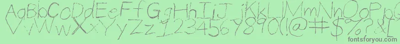 Fonte ThinPencilHandwriting – fontes cinzas em um fundo verde