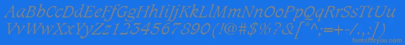 CaxtonLtLightItalic-Schriftart – Graue Schriften auf blauem Hintergrund