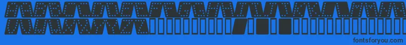DominoBredKursiv-fontti – mustat fontit sinisellä taustalla