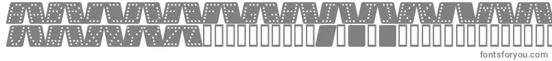 DominoBredKursiv-fontti – harmaat kirjasimet valkoisella taustalla