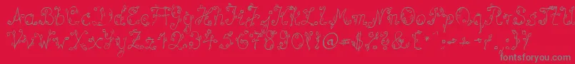 SpBlumeDb-Schriftart – Graue Schriften auf rotem Hintergrund