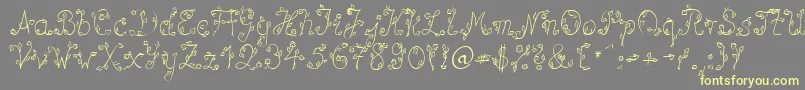 SpBlumeDb Font – Yellow Fonts on Gray Background