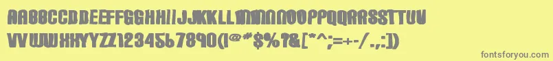 Fonte Carbonblockink – fontes cinzas em um fundo amarelo