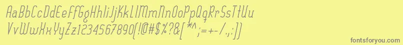 SexythingRegularItalic-fontti – harmaat kirjasimet keltaisella taustalla