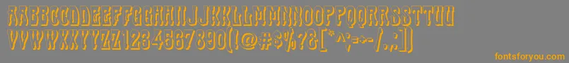 フォントCabas – オレンジの文字は灰色の背景にあります。
