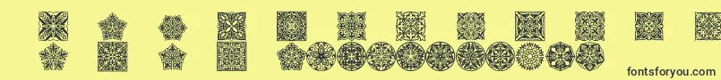 Prtornament5-Schriftart – Schwarze Schriften auf gelbem Hintergrund
