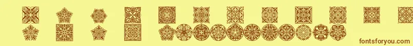 Шрифт Prtornament5 – коричневые шрифты на жёлтом фоне